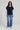 sleeveless roundneck vest with raveled thread on sleeve, neck
