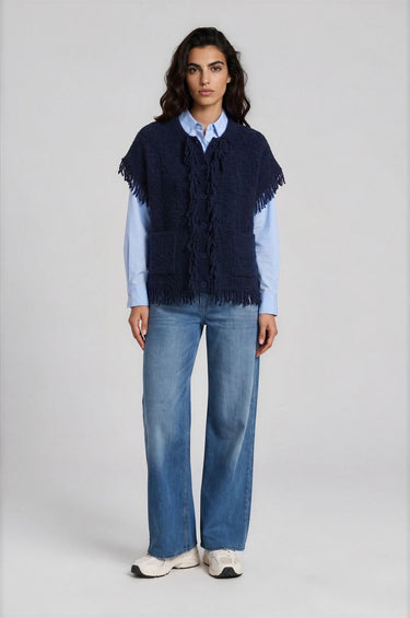 sleeveless roundneck vest with raveled thread on sleeve, neck